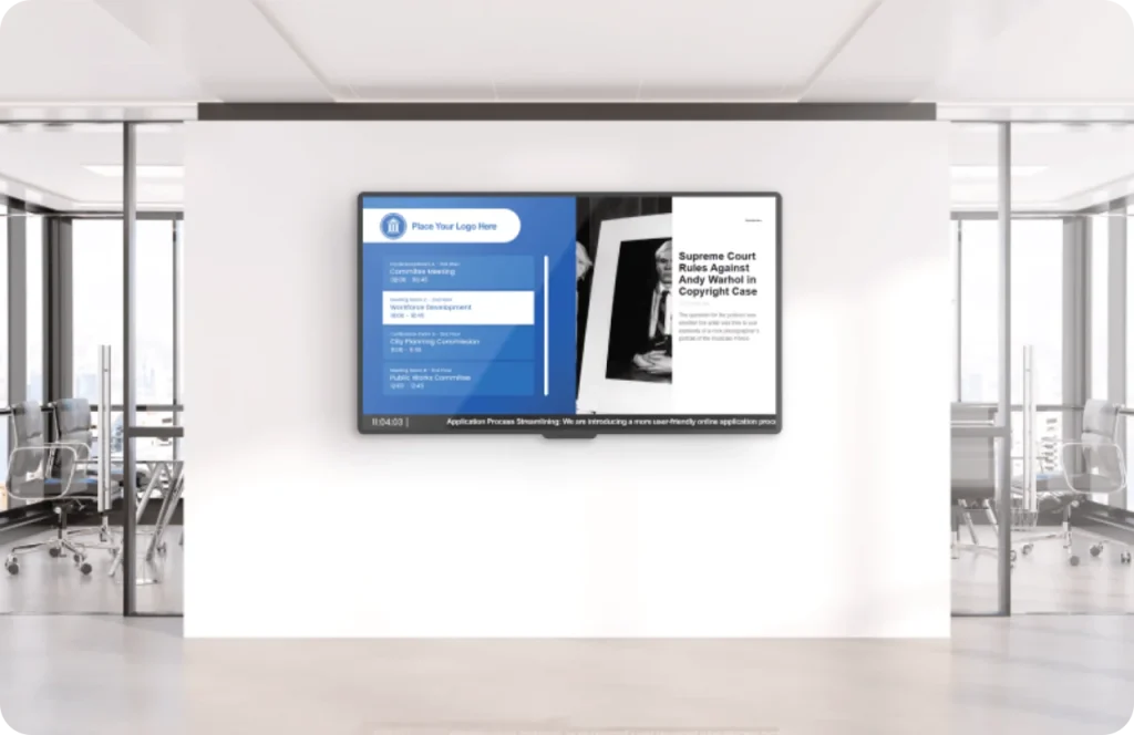 A screen in a office showing content through Wioplex's Digital signage software