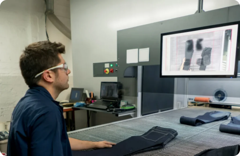 A worker examines his products on a digital screen.